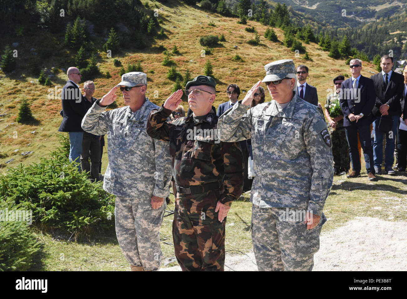 U.S. Army Command Sgt. Maj. Harley Schwind, NATO Headquarters Sarajevo command senior enlisted leader,  Col. Gyula Kovács, NHQSa chief of staff, and Brig. Gen. Giselle Wilz, NHQSa commander, paid respects during a memorial ceremony at Fojnica, Bosnia and Herzegovina Sept. 17, 2015.  On Sept. 17, 1997, 12 people were killed and four injured when a helicopter carrying a United States delegation slammed into a fog-shrouded Bosnian mountainside. (U.S. Air Force photo by Master Sgt. JT May III) Stock Photo