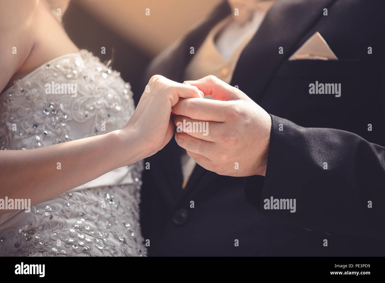 Wedding couple holding hands a symbol of love and marriage. Stock Photo