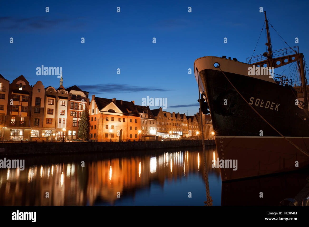 Old Town in city of Gdansk at night, Soldek Ship (National Maritime Museum), former coal and ore freighter on Motlawa River in Poland Stock Photo