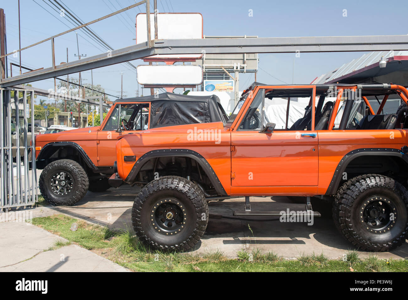A view of vintage suv trucks cars in the street in Venice, California