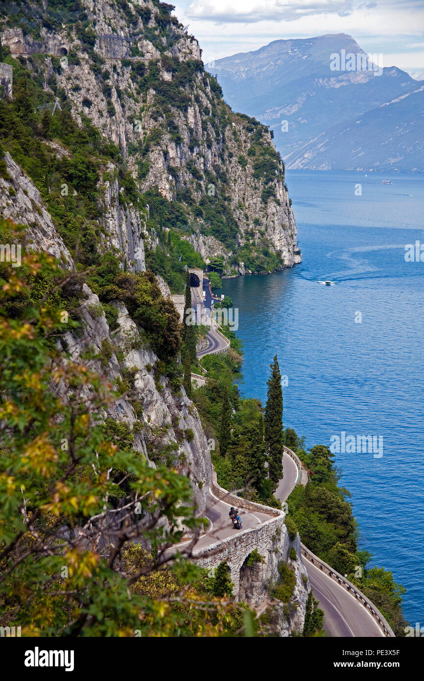 Lakeside road at steep westbank of Garda Lake, Lombardy, Italy Stock Photo