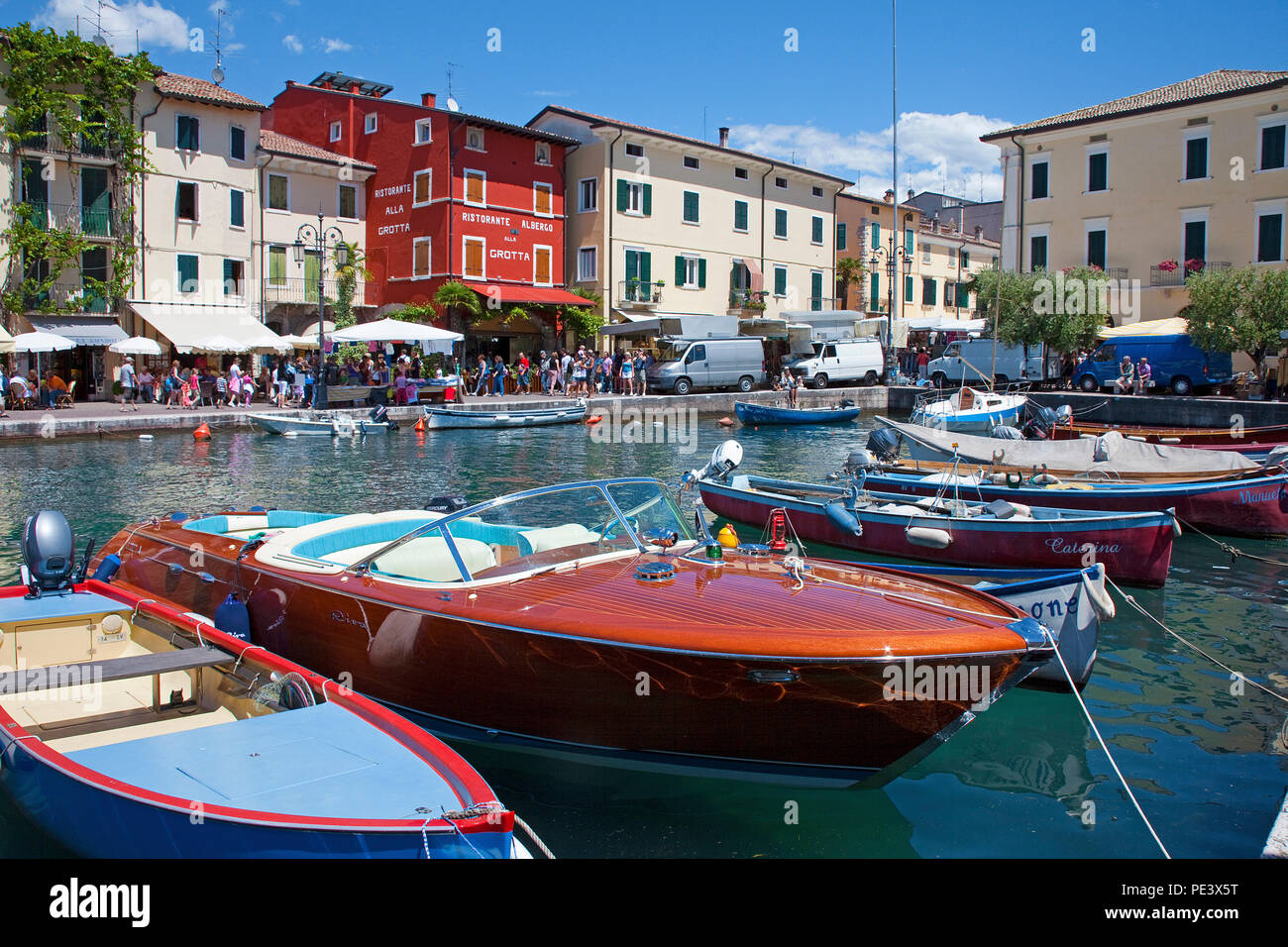 Riva boat, luxury boat at the harbour of Lazise, Garda lake, province Verona, Italy Stock Photo