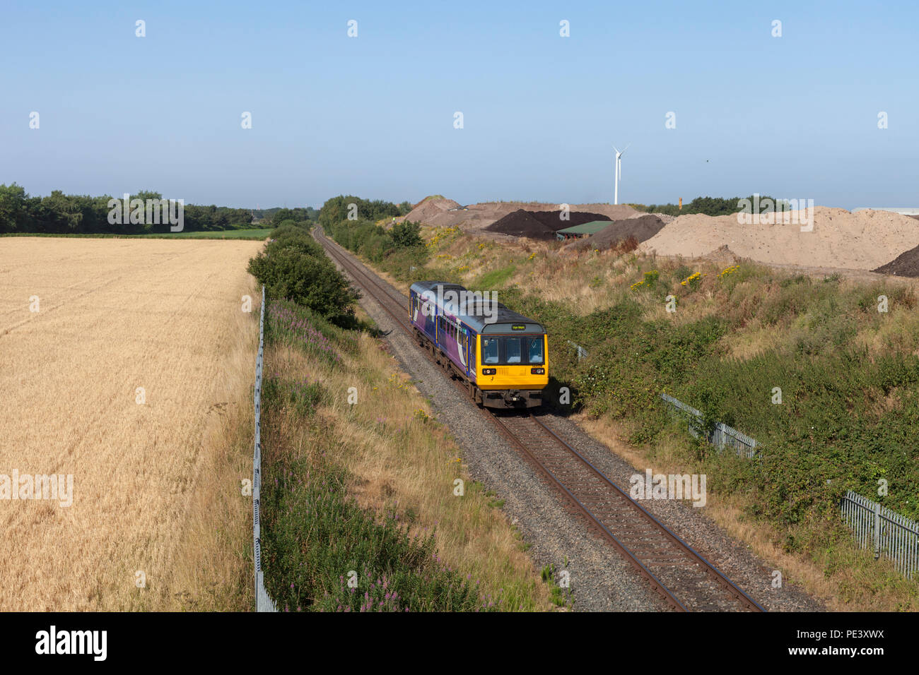 An Arriva Northern rail pacer trasin passign Bickerstaffe on the single track Wigan to Kirkby railway line Stock Photo