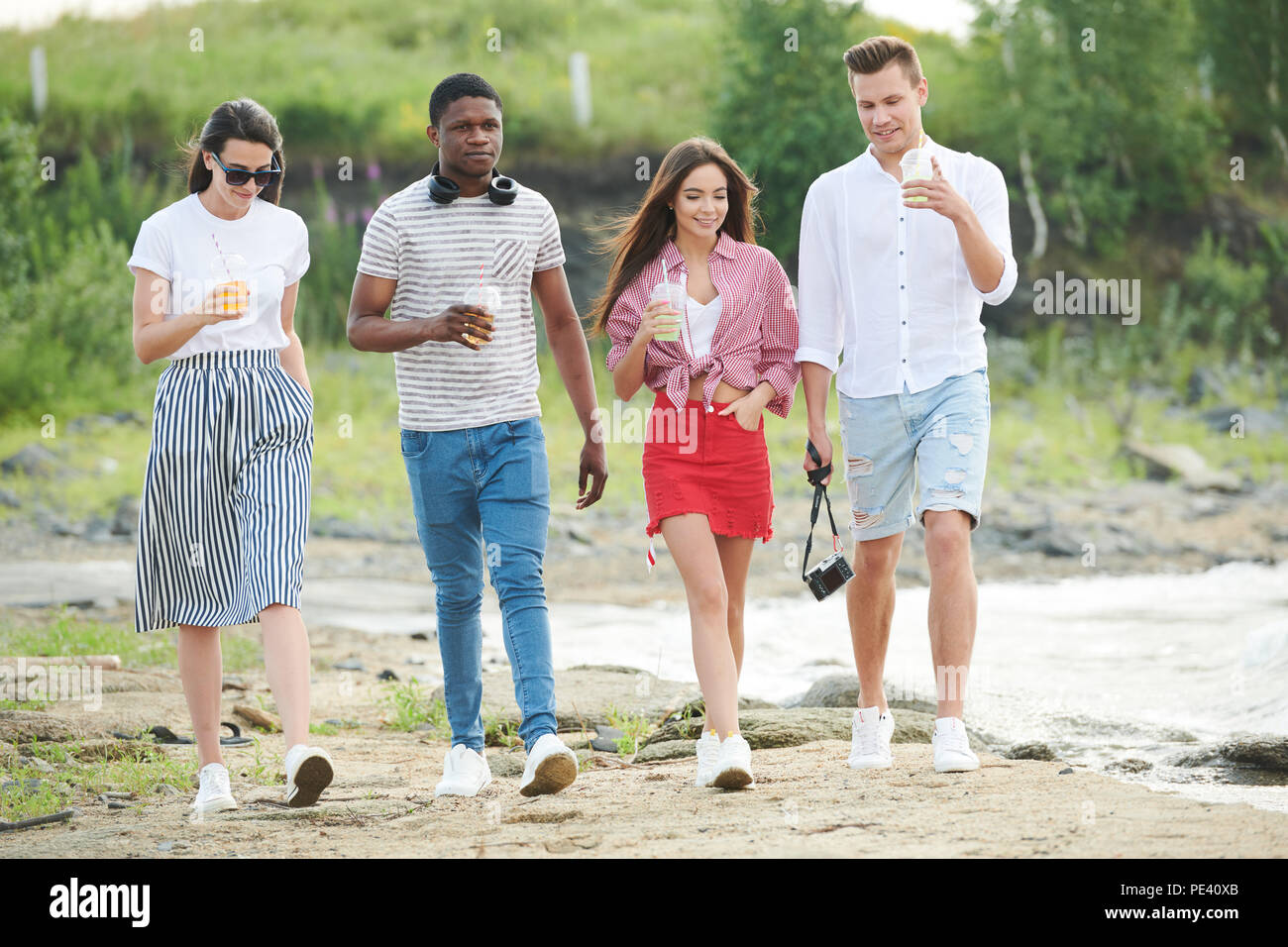 Young people walking outdoors Stock Photo