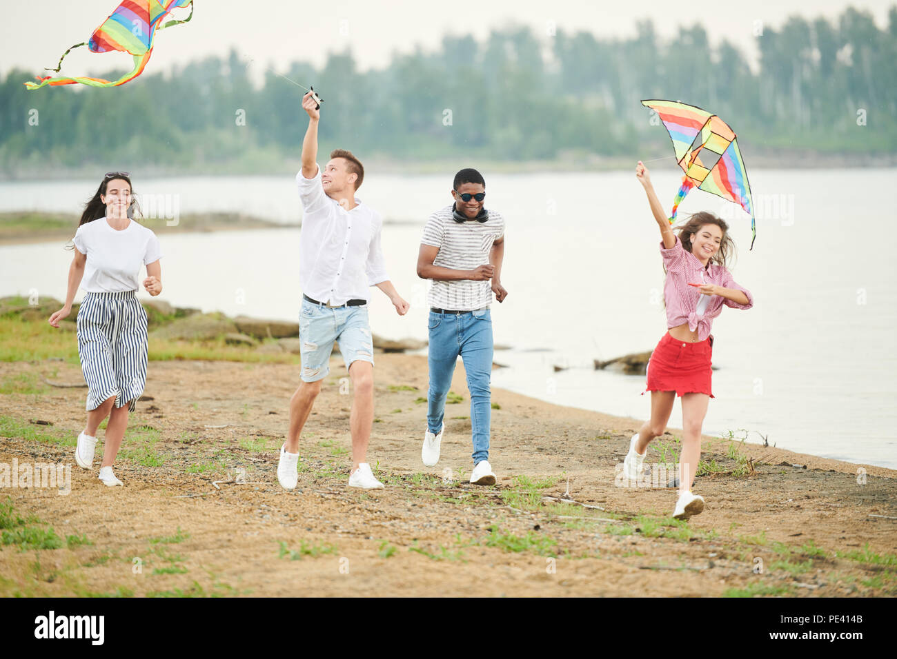 People playing with kites Stock Photo