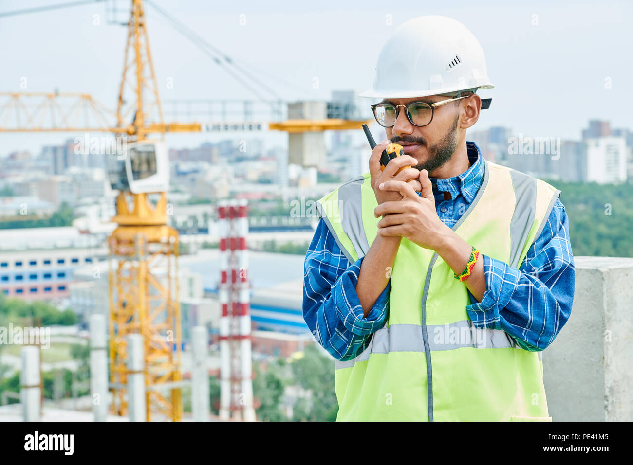 Construction engineer using radio Stock Photo