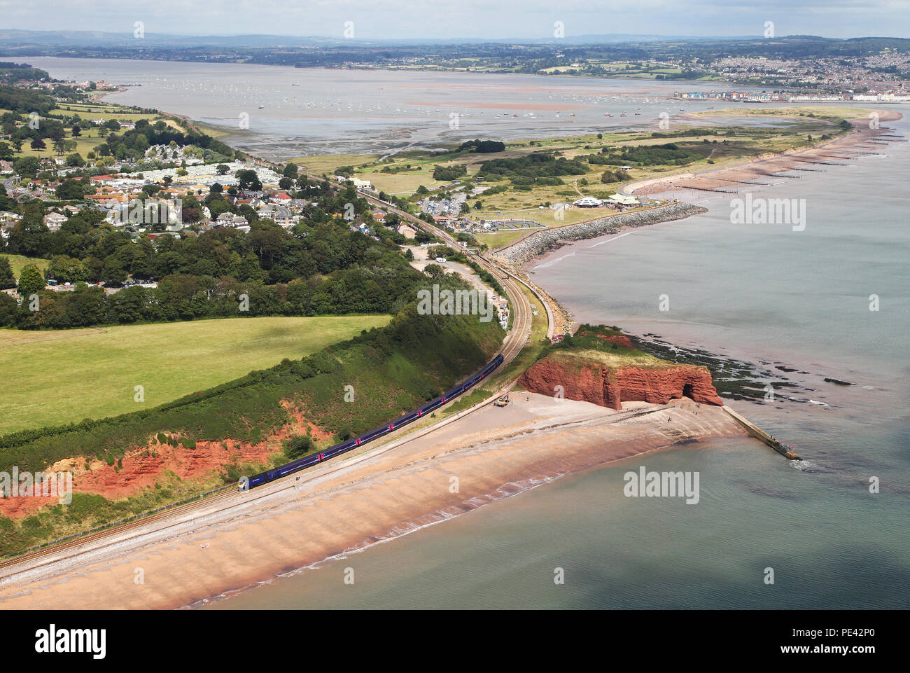 A HST head past Dawlish Warren from the air. Stock Photo