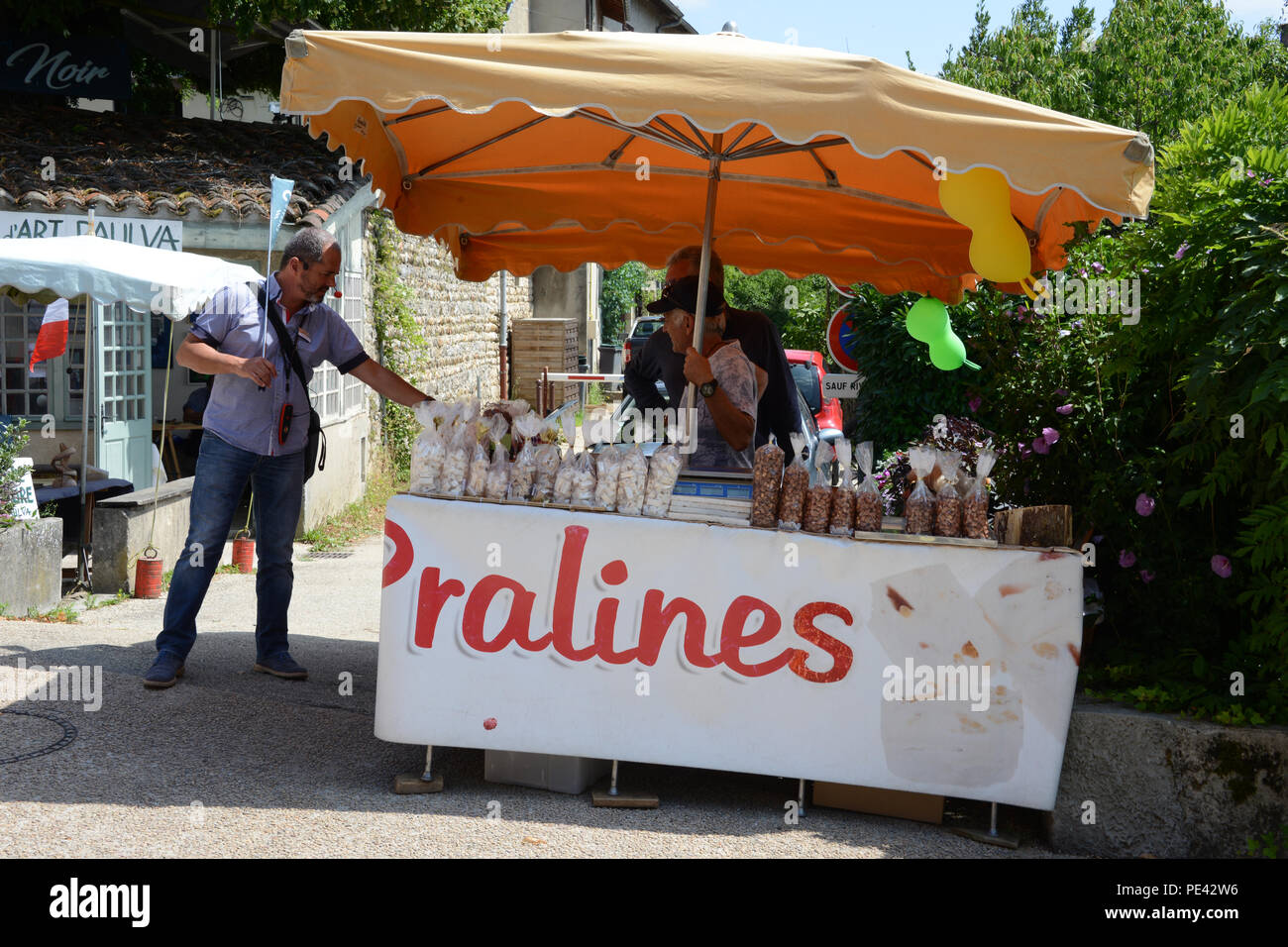 Snack stall outside the entrance to the village of Perouges, France ...