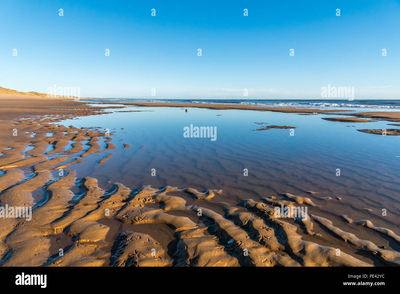 Balmedie beach sand and water Stock Photo - Alamy