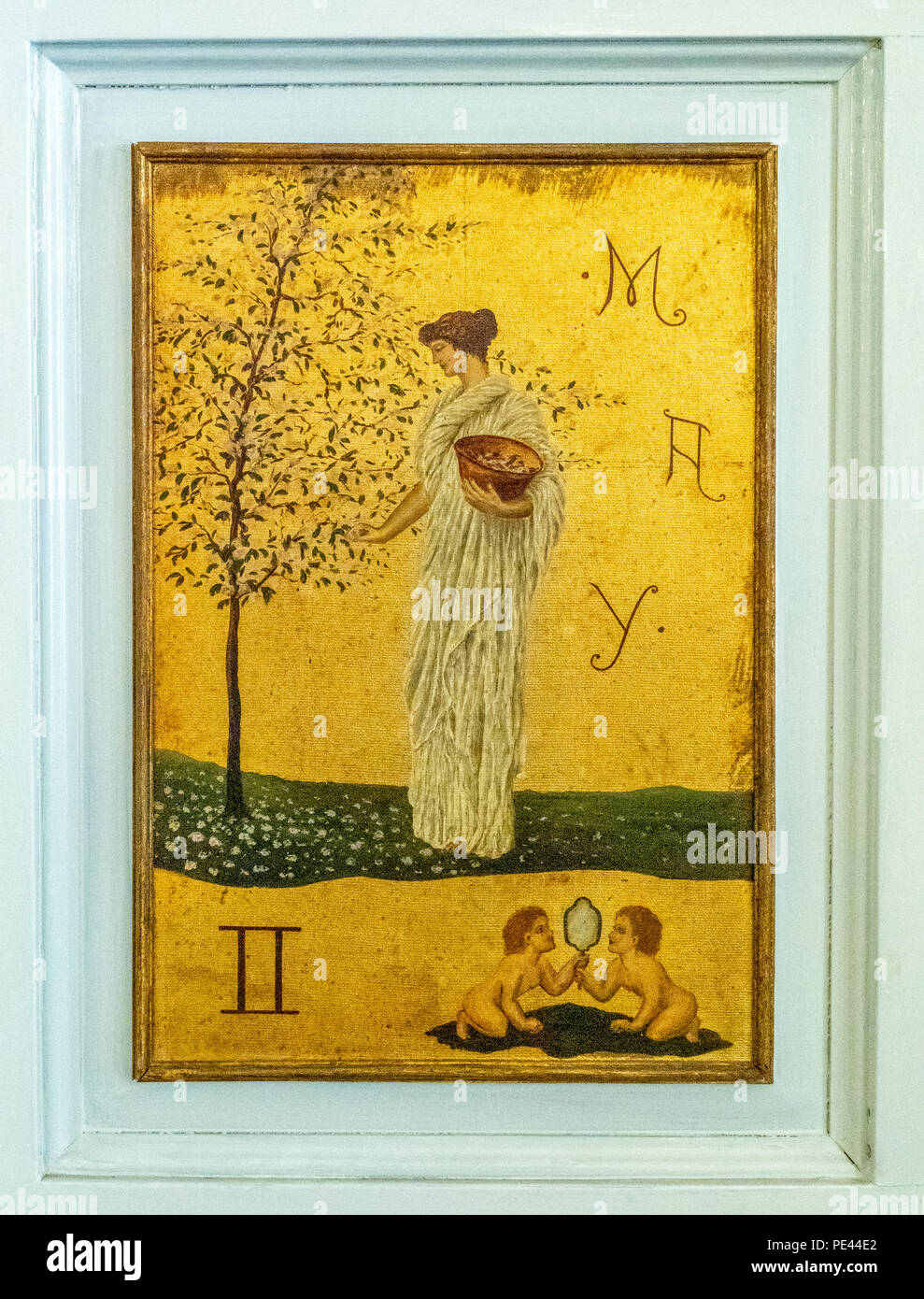 Door panels in the saloon of the Dublin Writers Museum painted on gold leaf showing wistful classical women representing months of year and zodiac Stock Photo