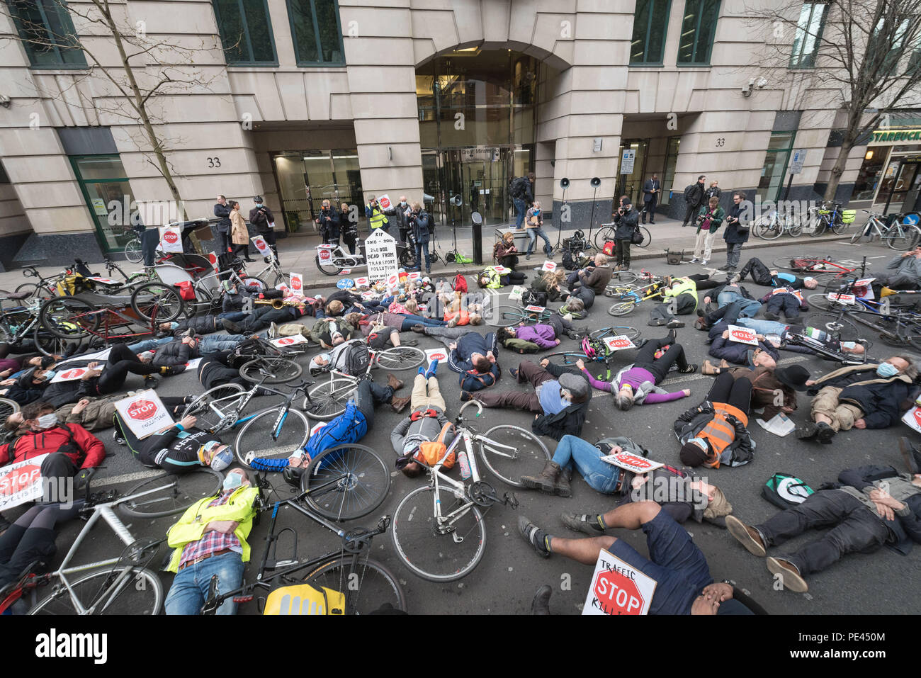 Department for Transport, Horseferry Road, London, UK. 27th April 2016.  A Stop Killing Cyclists Transport Pollution Die-In protest is held outside th Stock Photo