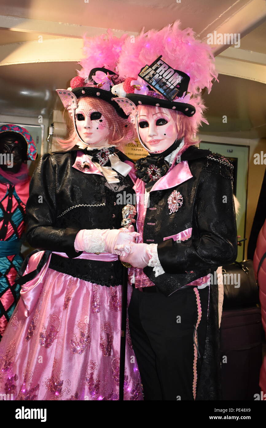 Couple in fancy dress with venetian face masks. annual Venice festival in January 2018 Stock Photo