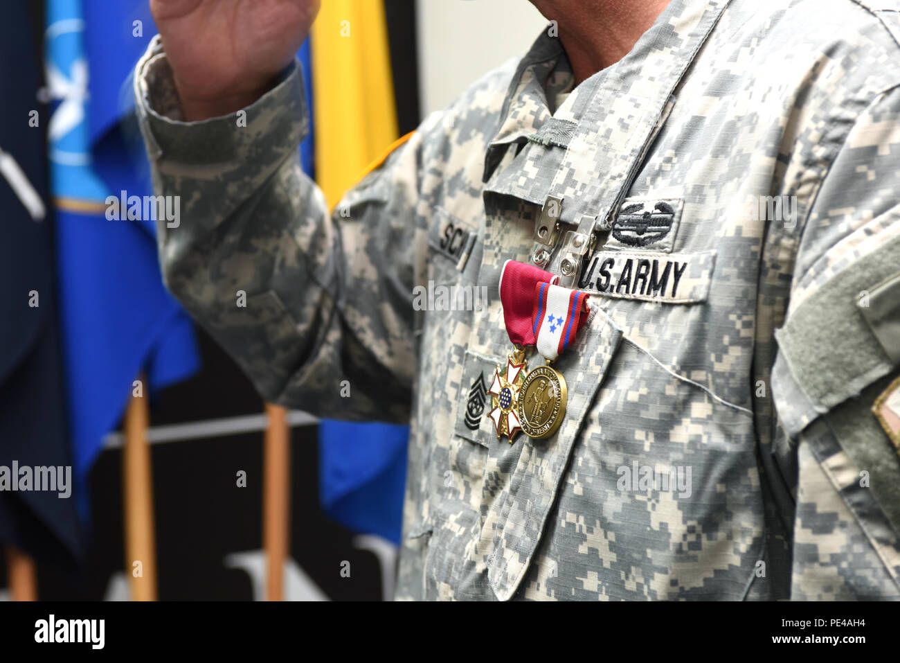 U.S. Army Brig. Gen. Giselle Wilz, NATO Headquarters Sarajevo commander, awards Command Sgt. Maj. Harley Schwind, NHQSa command senior enlisted leader, with the Legion of Merit Medal Sept. 7, 2015 at Camp Butmir in Sarajevo, Bosnia and Herzegovina. Schwind received the medal for exceptionally meritorious service to the North Dakota Army National Guard. He also received the state Legion of Merit Medal.  (U.S. Air Force photo by Master Sgt. JT May III) Stock Photo