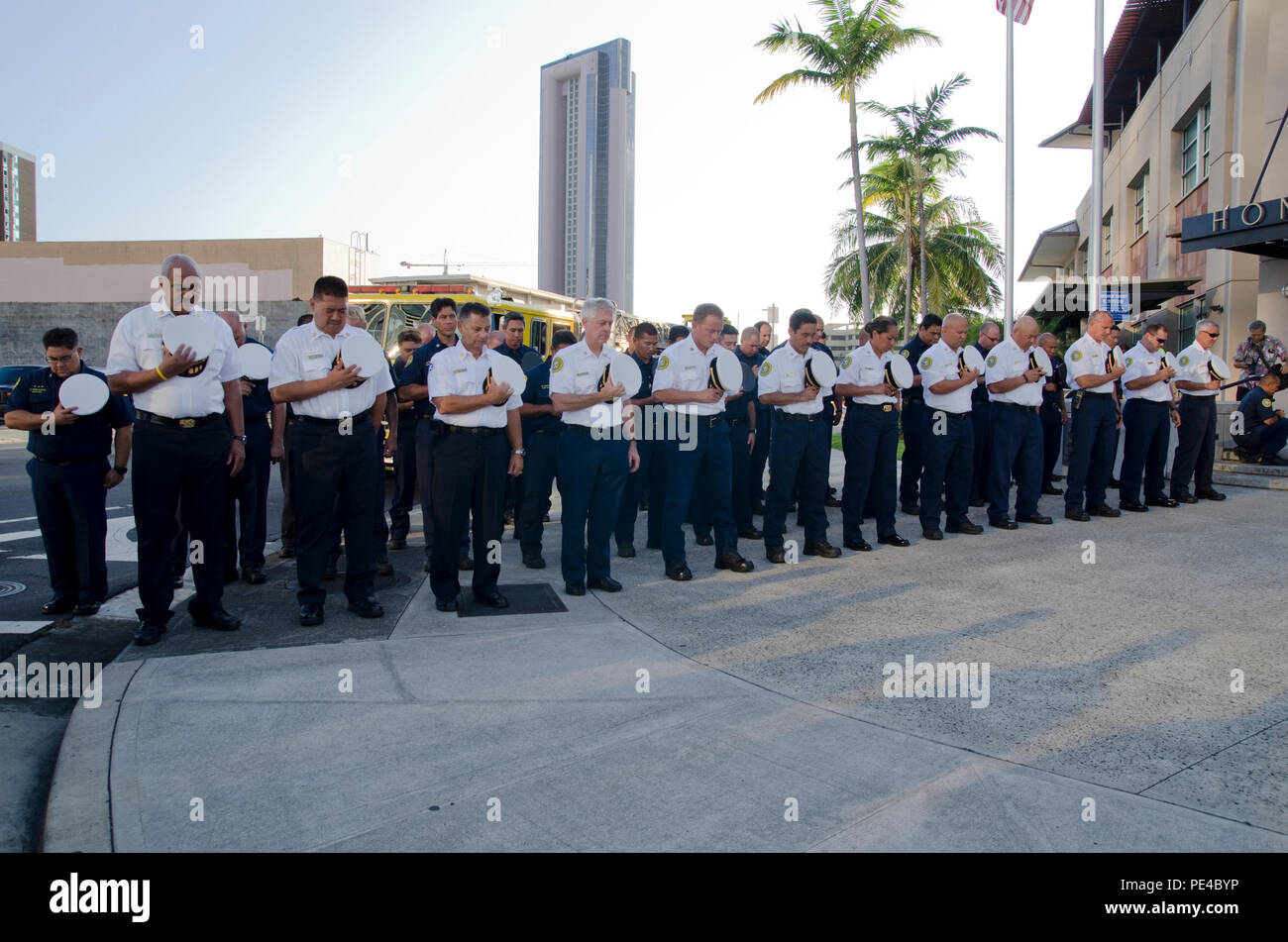 Members Of The Honolulu Fire Department Remove Their Hats In Respect During The Second Ceremony 