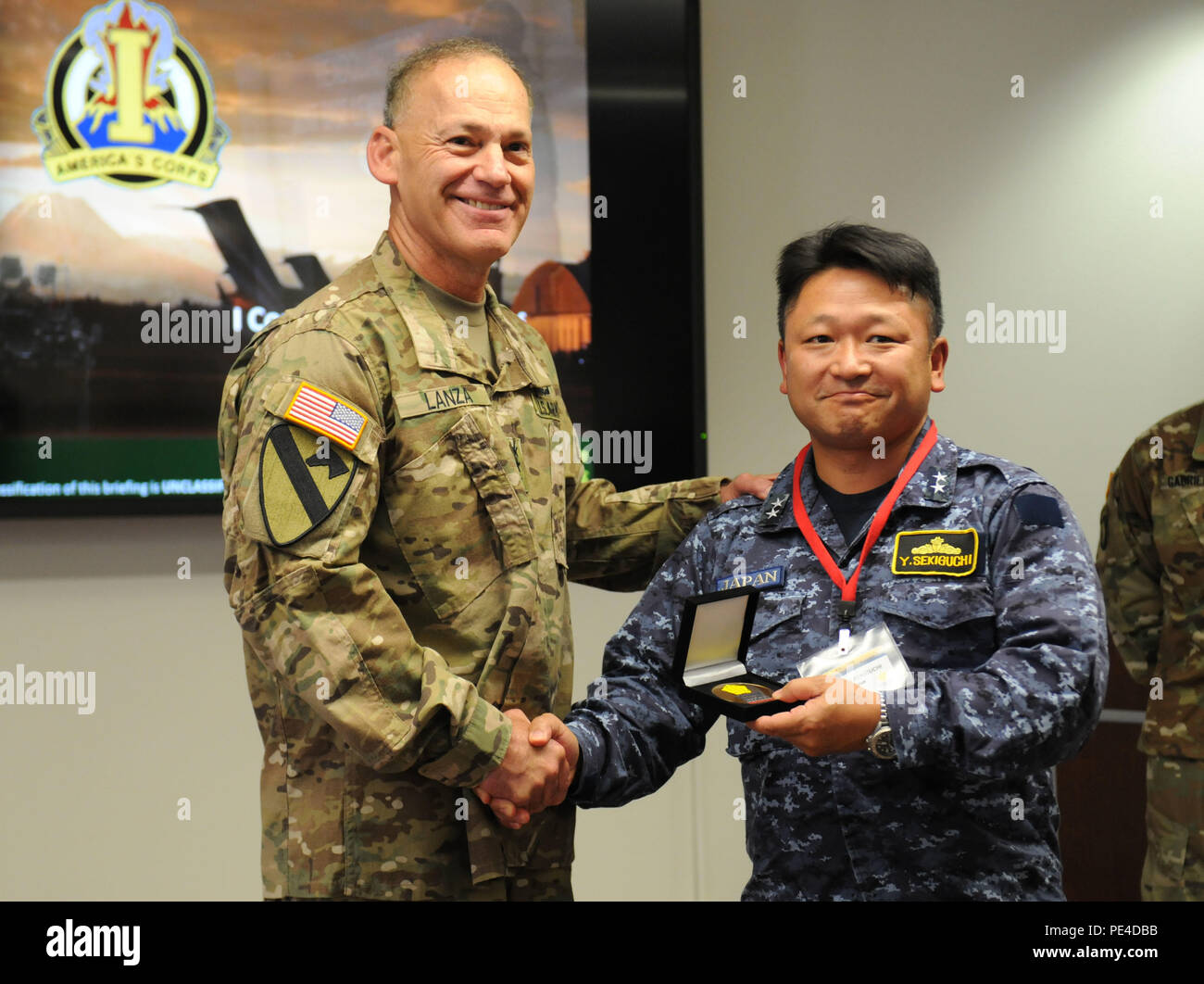 Lt. Gen. Stephen R. Lanza, I Corps commanding general, shakes hands ...