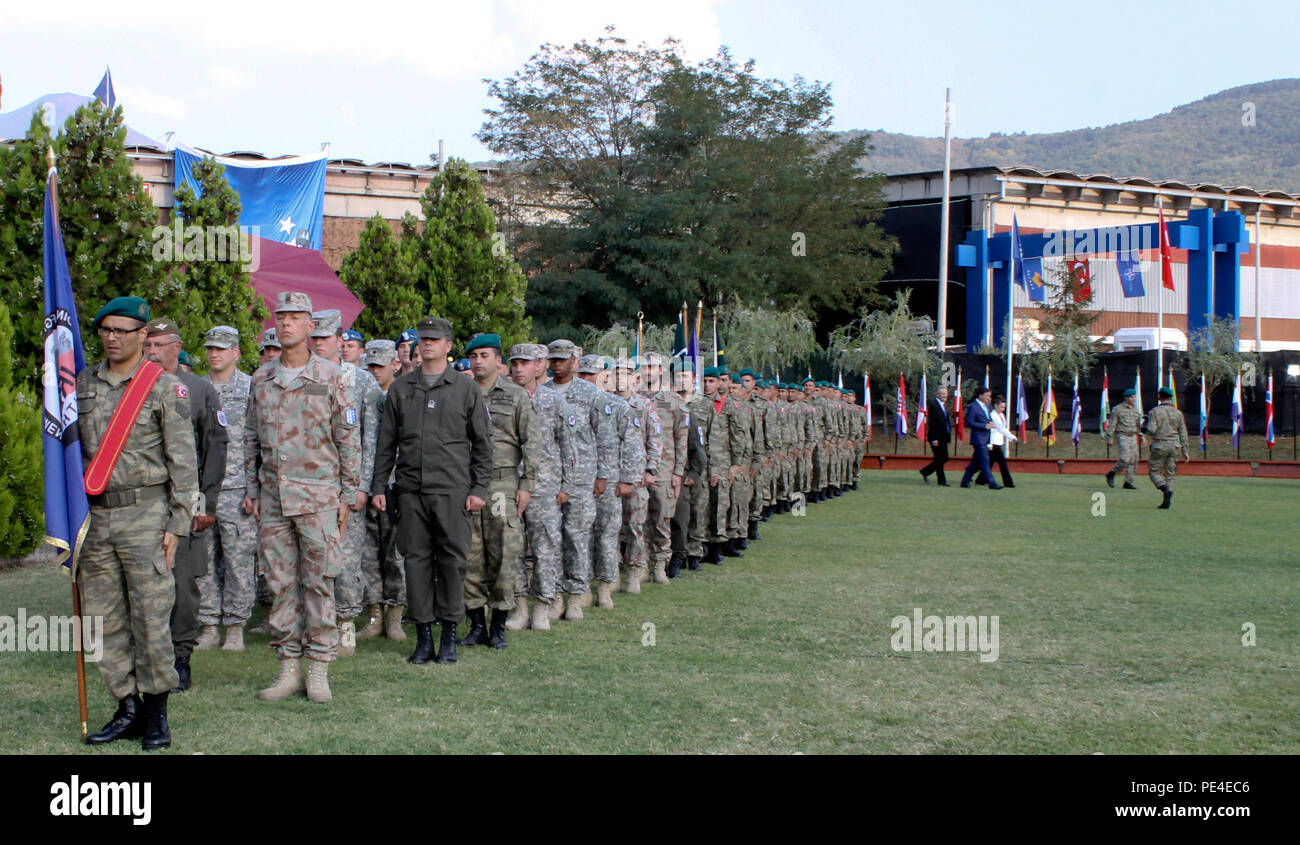 Multinational Kosovo Force soldiers assigned to Joint Regional Detachment-South enter a parade field during a change of command ceremony for JRD-S and the Turkish National Command Contingent to Kosovo, Sept. 3, 2015, in Prizren, Kosovo. These forces include Turkish soldiers, as well as U.S. Army liaison monitoring teams from the West Virginia National Guard. During the ceremony, Turkish Col. Omer Faruk Demircioglu formally handed command to Col. Saim Bagci. (U.S. Army photo by Sgt. Erick Yates, Multinational Battle Group-East) Stock Photo