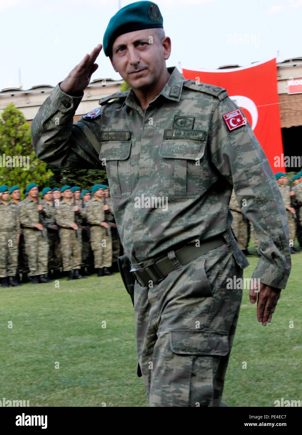 Turkish Col. Omer Faruk Demircioglu, outgoing commander for the Turkish National Command Contingent to Kosovo and Joint Regional Detachment-South, salutes the official party during his change of command ceremony Sept. 3, 2015, in Prizren, Kosovo. JRD-S and its liaison monitoring teams are part of NATO’s peace support mission in the region, known as Kosovo Force. (U.S. Army photo by Sgt. Erick Yates, Multinational Battle Group-East) Stock Photo