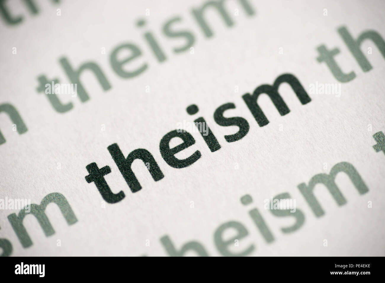 word theism printed on white paper macro Stock Photo