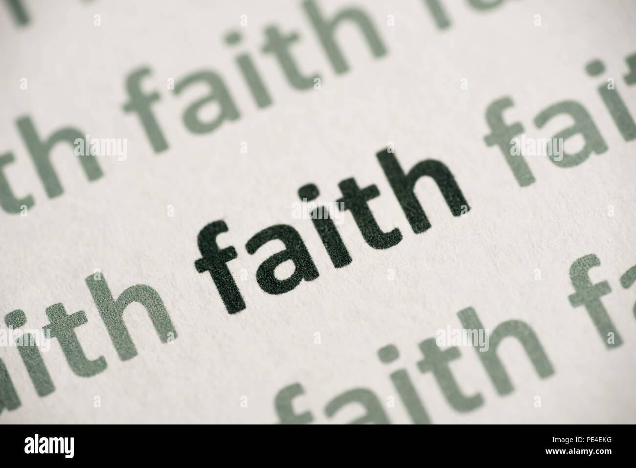 word faith printed on white paper macro Stock Photo