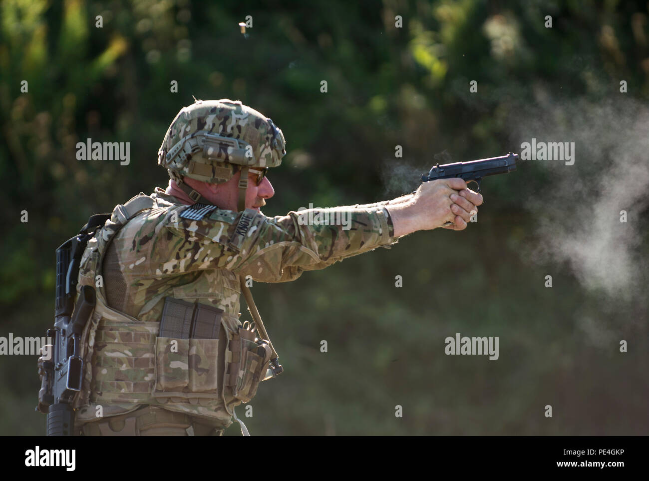 Chief Warrant Officer Two Andy Knote, of North Chicago, U.S. Army Reserve International Combat Team competitor, shoots down target plates on a 25-meter pistol range during a 7-kilometer Rifle Military Biathlon match involving several physical obstacles during the 2015 Canadian Armed Forces Small Arms Concentration at the Connaught Range outside of Ottawa, Canada, Sept. 14. The international marksmanship competition lasted roughly two weeks, bringing in more than 250 total competitors from the British, Canadian and U.S. armed forces competing in more than 50 matches involving rifle, pistol and  Stock Photo