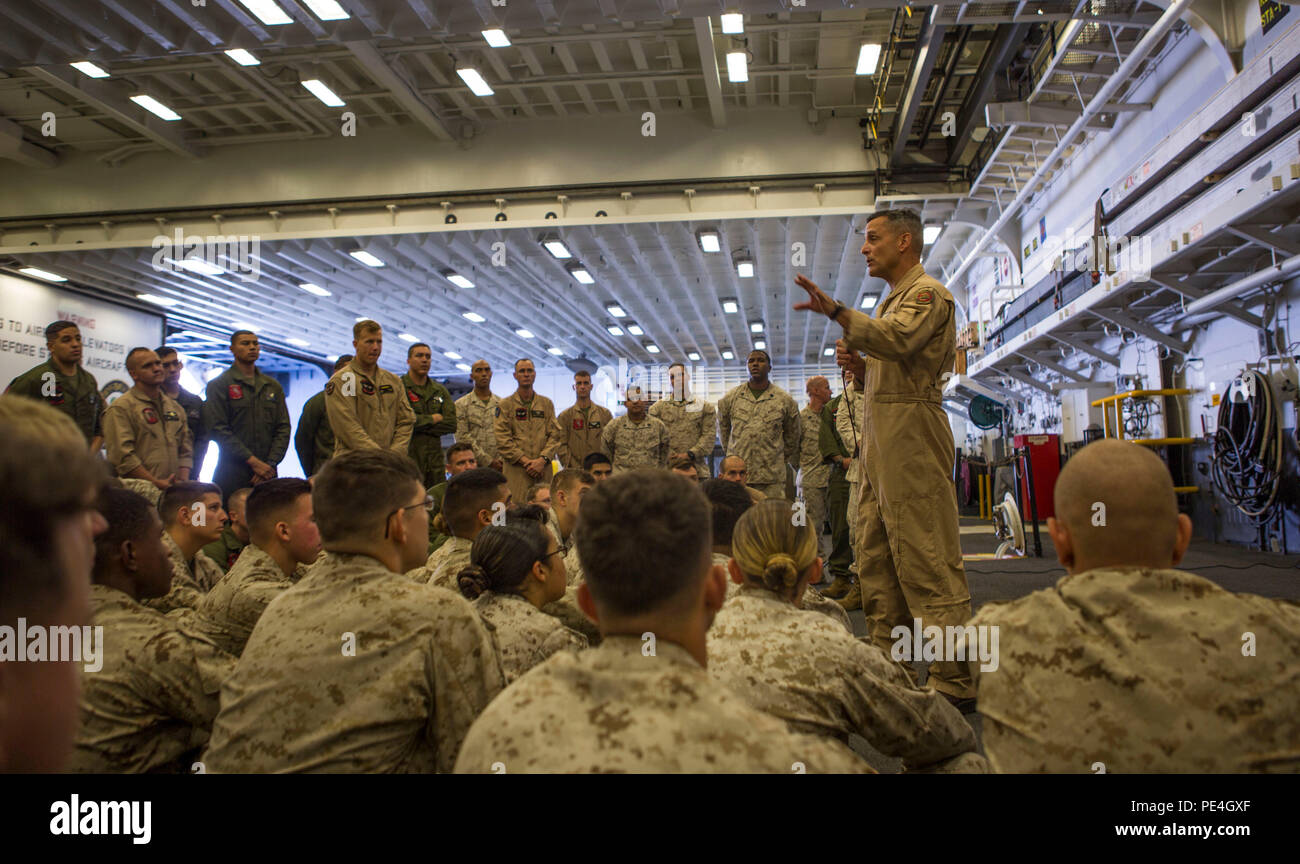 Marine Corps Maj. Gen. Michael A. Rocco, commanding general of 3rd Marine Aircraft Wing, I Marine Expeditionary Force, speaks to Marines with the air combat element aboard the amphibious assault ship USS Boxer (LHD 4) during Exercise Dawn Blitz 2015, Sept. 3, 2015. Rocco explained that each Marine and aircraft within 3rd MAW plays a vital role in training such as DB 2015 and in real-life missions. Dawn Blitz is a multinational amphibious training exercise held off the coast and ashore of Southern California which included ESG-3 and 1st Marine Expeditionary Brigade as well as Japan, Mexico, New Stock Photo