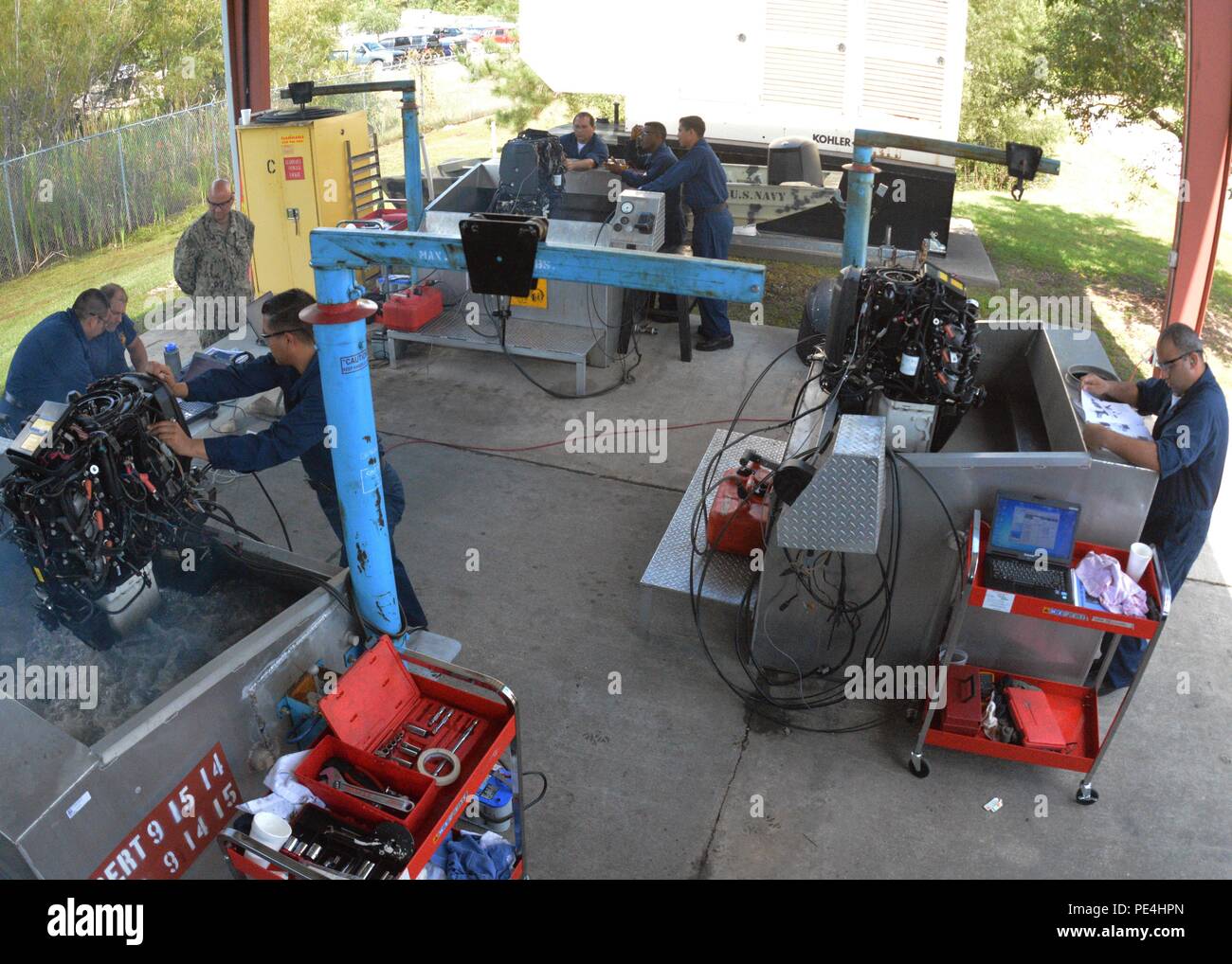 Outboard Maintenance Course International students at NAVSCIATTS conduct outboard motor maintenance ...