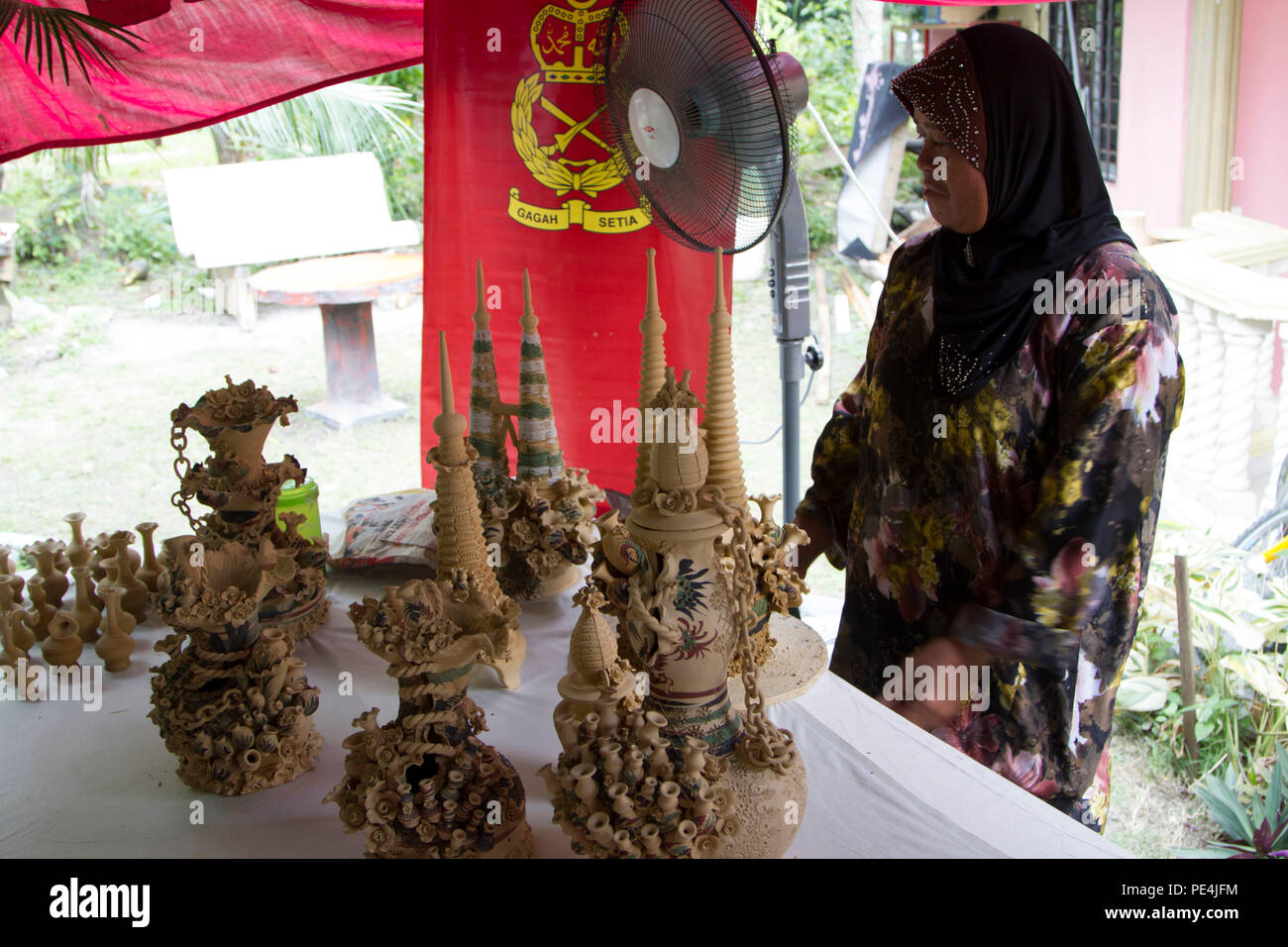 A Malaysian woman explains the weeklong process of creating each of