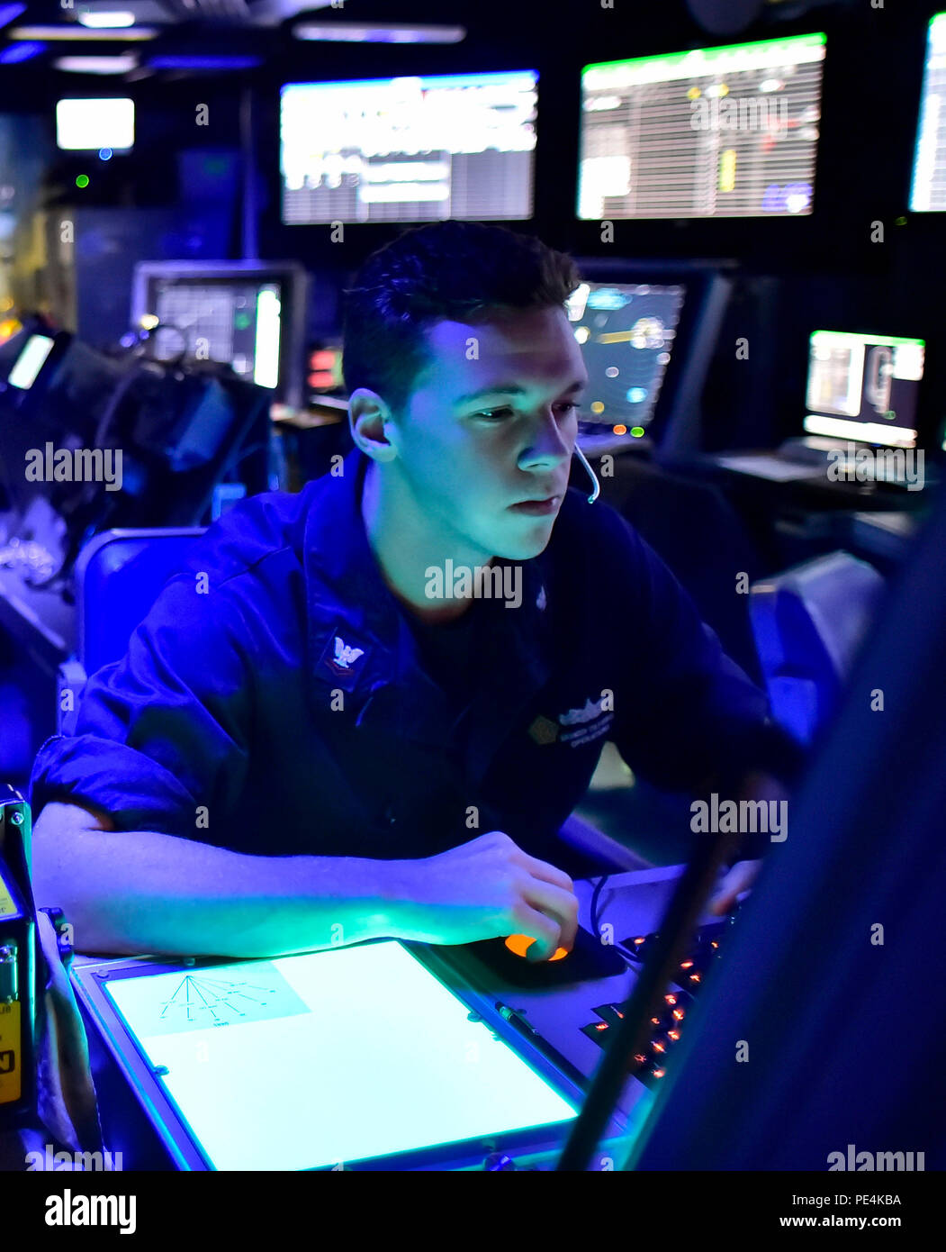 150917-N-ZZZ99-007  ATLANTIC OCEAN (Sept. 17, 2015) - Air Traffic Controller 2nd Class Branden Culp-Henise monitors a radar in the Carrier Air Traffic Control Center of the aircraft carrier USS Dwight D. Eisenhower (CVN 69). Dwight D. Eisenhower is underway conducting carrier qualifications. (U.S. Navy photo by Mass Communication Specialist Seaman Apprentice Liam N. Antinori/Released) Stock Photo