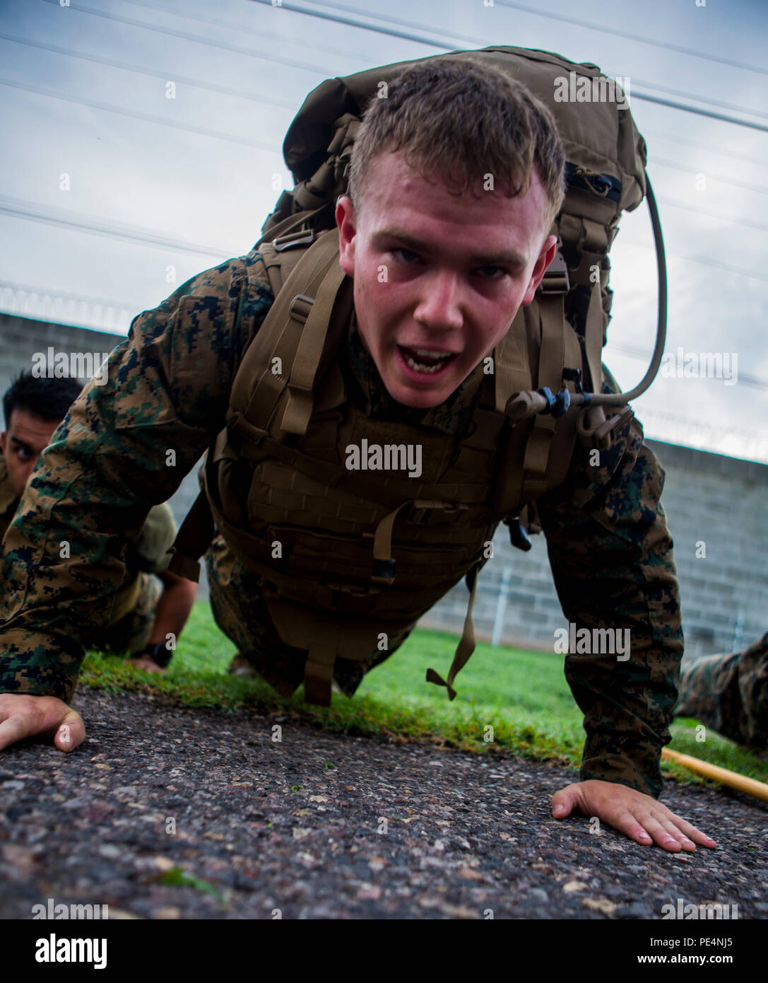 U.S. Marine Corps Cpl. Brendan Betz, an aircraft mechanic and Langhorne, Pa., native, with Special Purpose Marine Air-Ground Task Force-Southern Command performs push-ups while participating in a five-kilometer pack run during a Marine Corps Martial Arts Instructor Course at Soto Cano Air Base, Honduras, Sept. 18, 2015. SPMAGTF-SC is a temporary deployment of Marines and Sailors throughout Honduras, El Salvador, Guatemala, and Belize with a focus on building and maintaining partnership capacity with each country through shared values, challenges, and responsibility. (U.S. Marine Corps Photo by Stock Photo