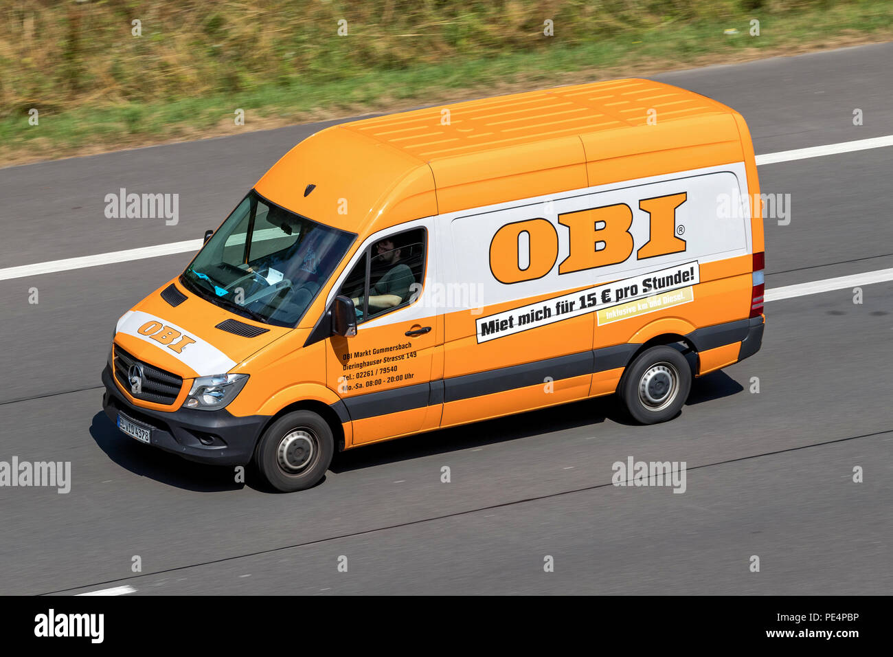 OBI van on motorway. OBI  is a German home improvement supplies retailing company. It is the largest DIY retailer in Europe. Stock Photo
