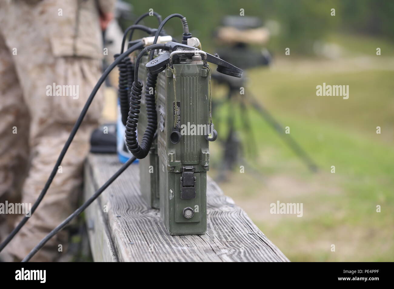 The Marines conducting fire support training use PRC-117 radios to