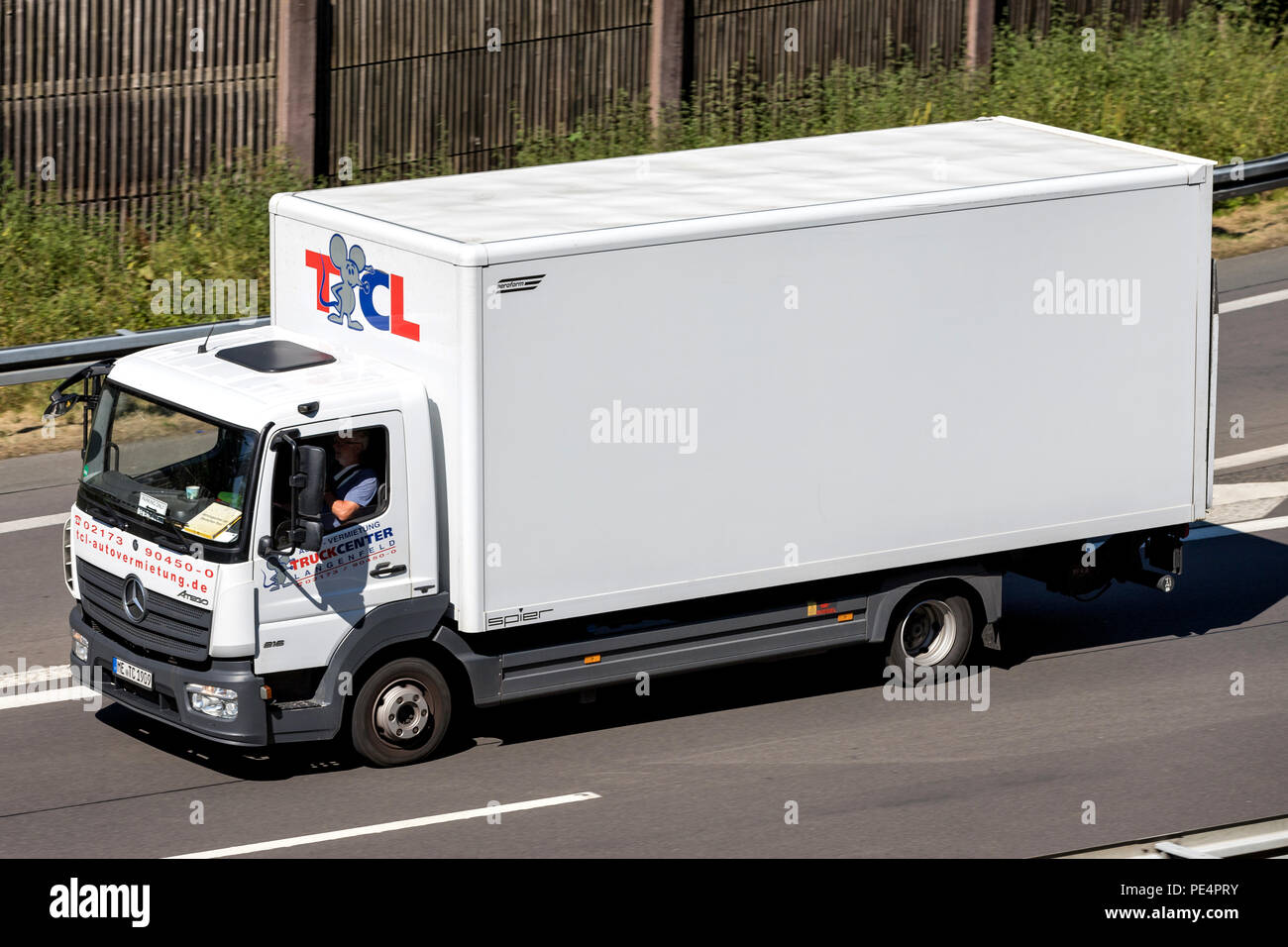Mercedes-Benz Atego of TCL on motorway. TCL is a German car and truck rental company, founded in 2000. Stock Photo