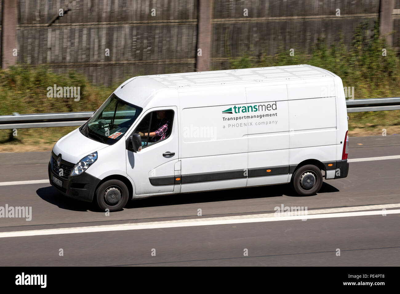 Transmed van on motorway. Transmed was foundet in 1970 and operates more than 3,000 vehicles, including 350 PharmaMobiles. Stock Photo