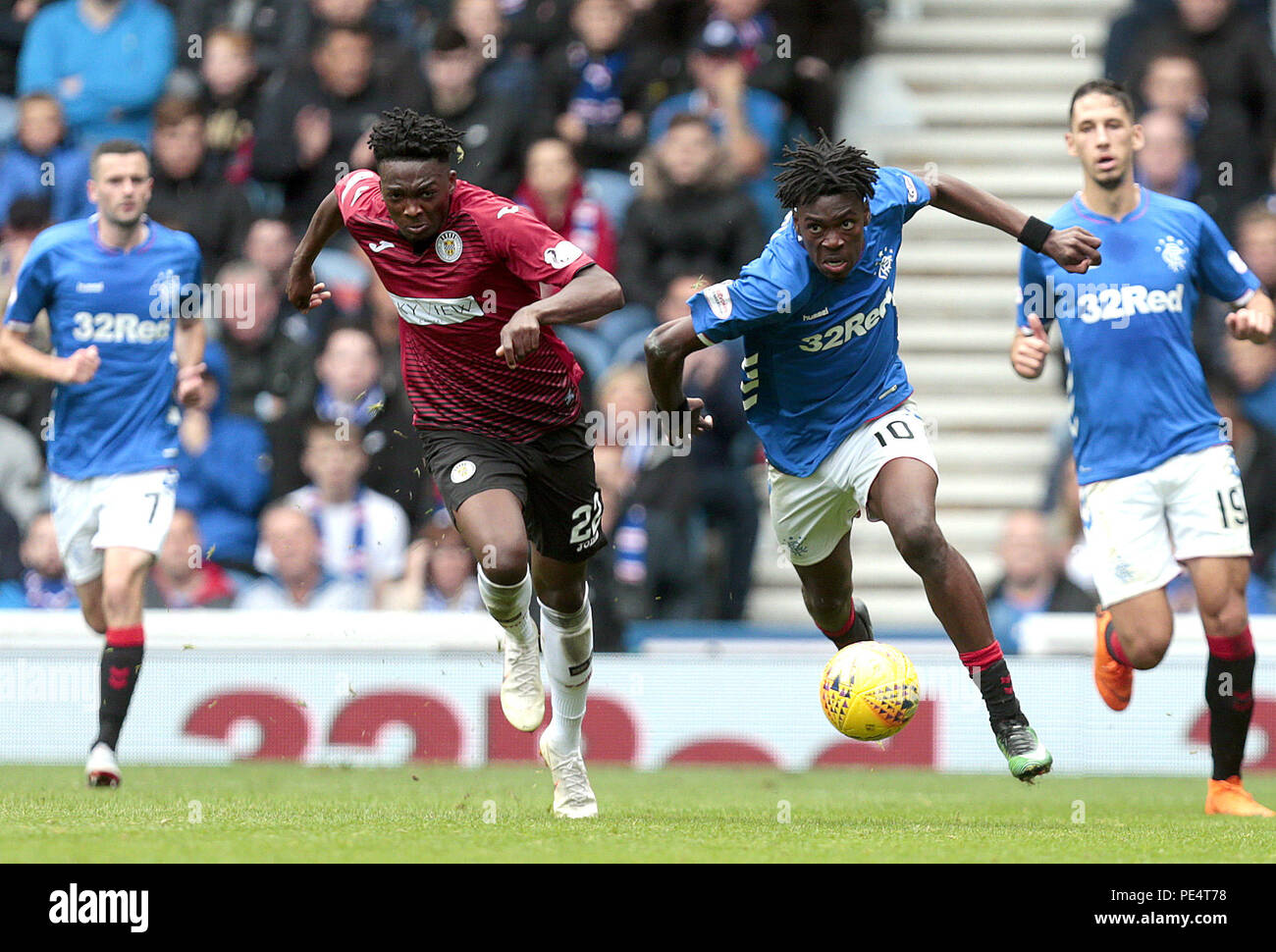 Rangers' Ovie Ejariaand St Mirren's Matty Willock (left) battle for the ...