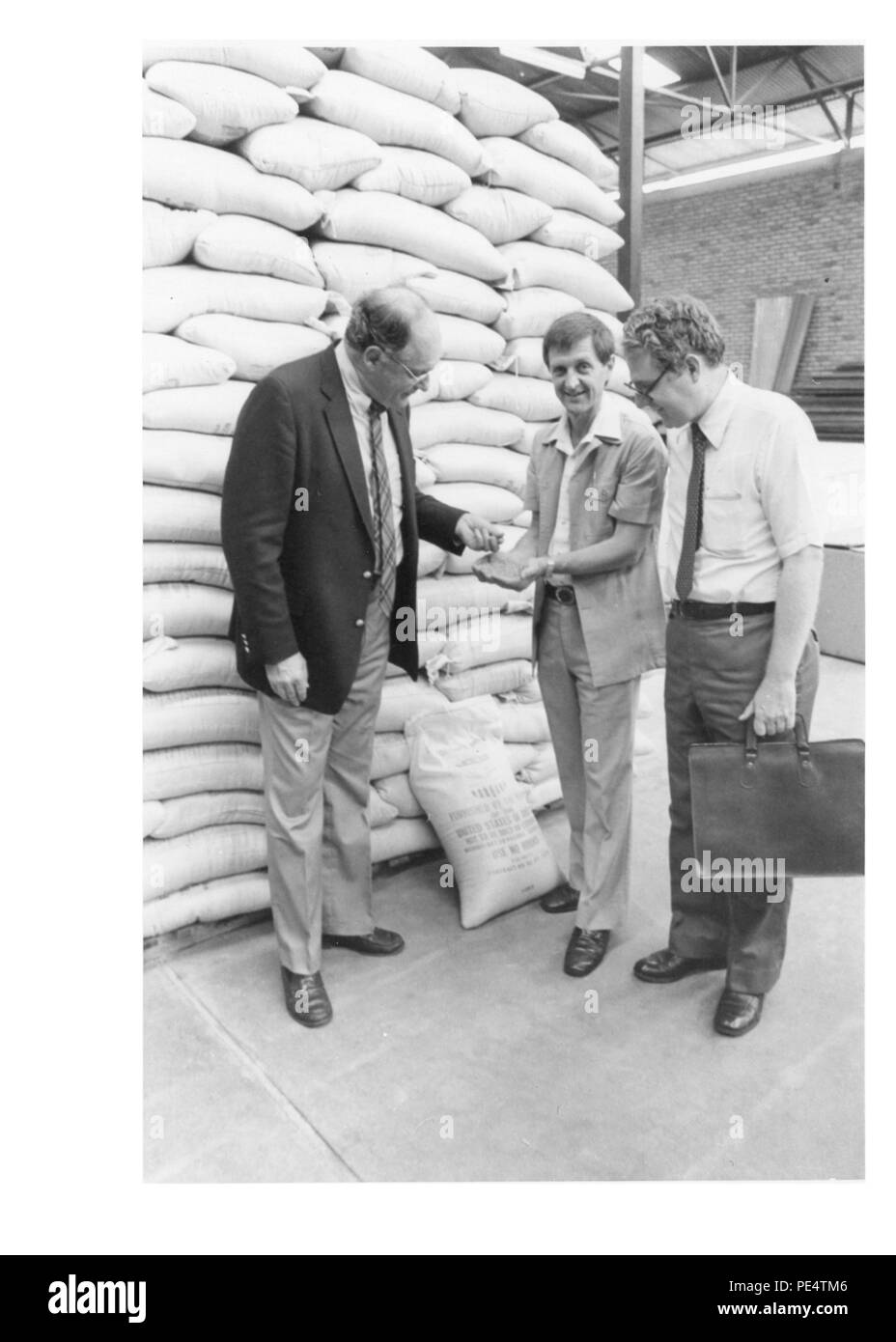 Food For Work Program In 1983, USAID food supplies stored in an ADRA warehouse in Kigali ...