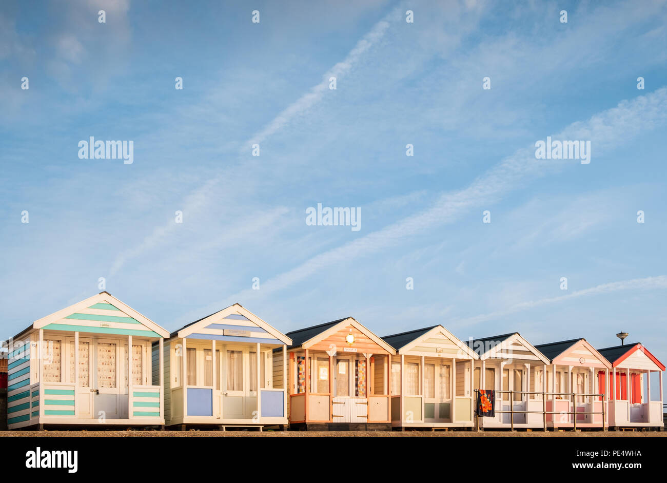 Row of colourful beach huts by the beach in Southwold, Suffolk Stock Photo