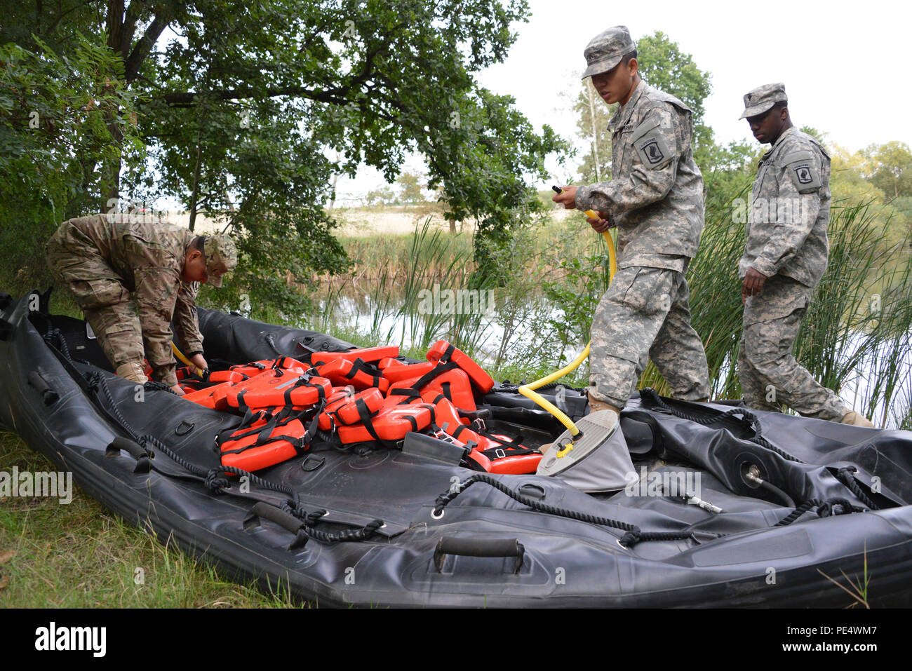 U.S. Army paratroopers, assigned to 1st Squadron, 91st Cavalry Regiment, 173rd Airborne Brigade, prepare a Zodiac inflatable boat as part of Exercise Sky Soldier II at Bechyne Training Area, Czech Republic, Sept. 22, 2015. Sky Soldier is a series of bilateral exercises between the 173rd Airborne Brigade and the Czech army’s 4th Rapid Reaction Brigades designed to increase interoperability and strengthen partnerships between NATO airborne forces. (U.S. Army photo by Visual Information Specialist Gertrud Zach/released) Stock Photo