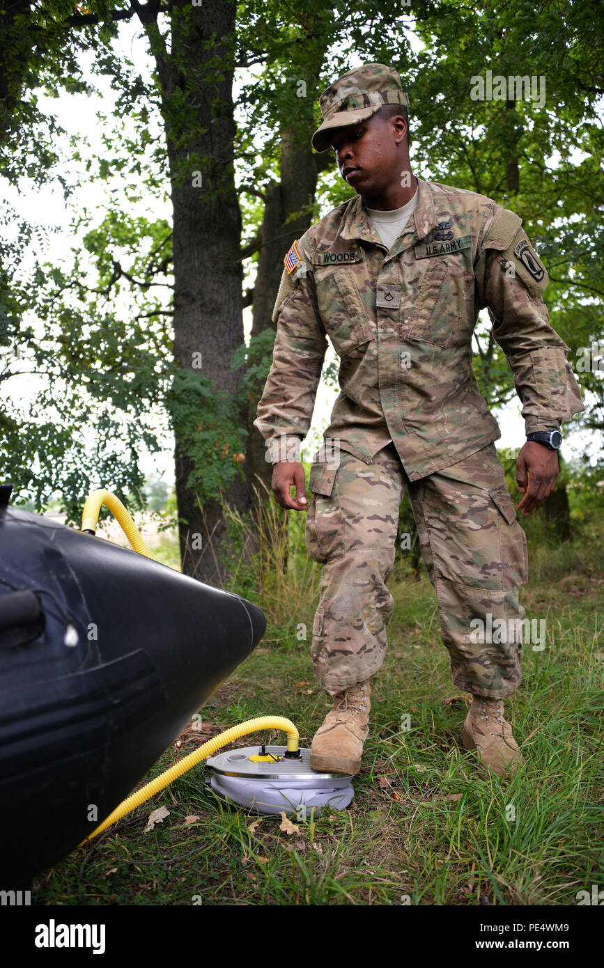 U.S. Army Pfc. Daniel Woods, a paratrooper assigned to 1st Squadron, 91st Cavalry Regiment, 173rd Airborne Brigade, prepares a Zodiac inflatable boat as part of Exercise Sky Soldier II at Bechyne Training Area, Czech Republic, Sept. 22, 2015. Sky Soldier is a series of bilateral exercises between the 173rd Airborne and Czech army’s 4th Rapid Reaction Brigades designed to increase interoperability and strengthen partnerships between NATO airborne forces. (U.S. Army photo by Visual Information Specialist Gertrud Zach/released) Stock Photo