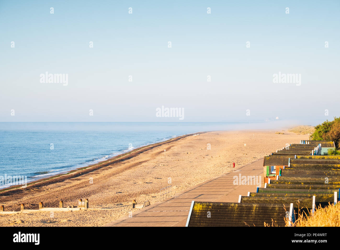 View from Southwold to Sizewell B, including beach huts and sand Stock Photo