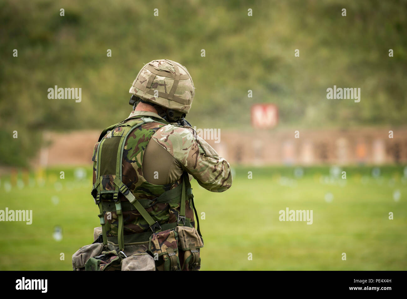 Royal Marines Ranges A British Royal Marine engages targets down range with a service rifle ...