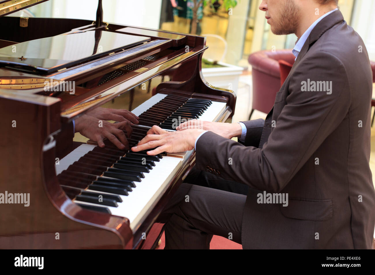 Playing Piano Suit High Resolution Stock Photography and Images - Alamy