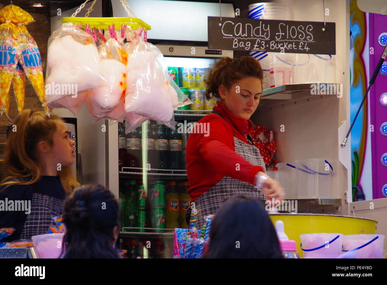 Young Woman Spinning Candy Floss at a Snack Van. Bristol Balloon Fiesta