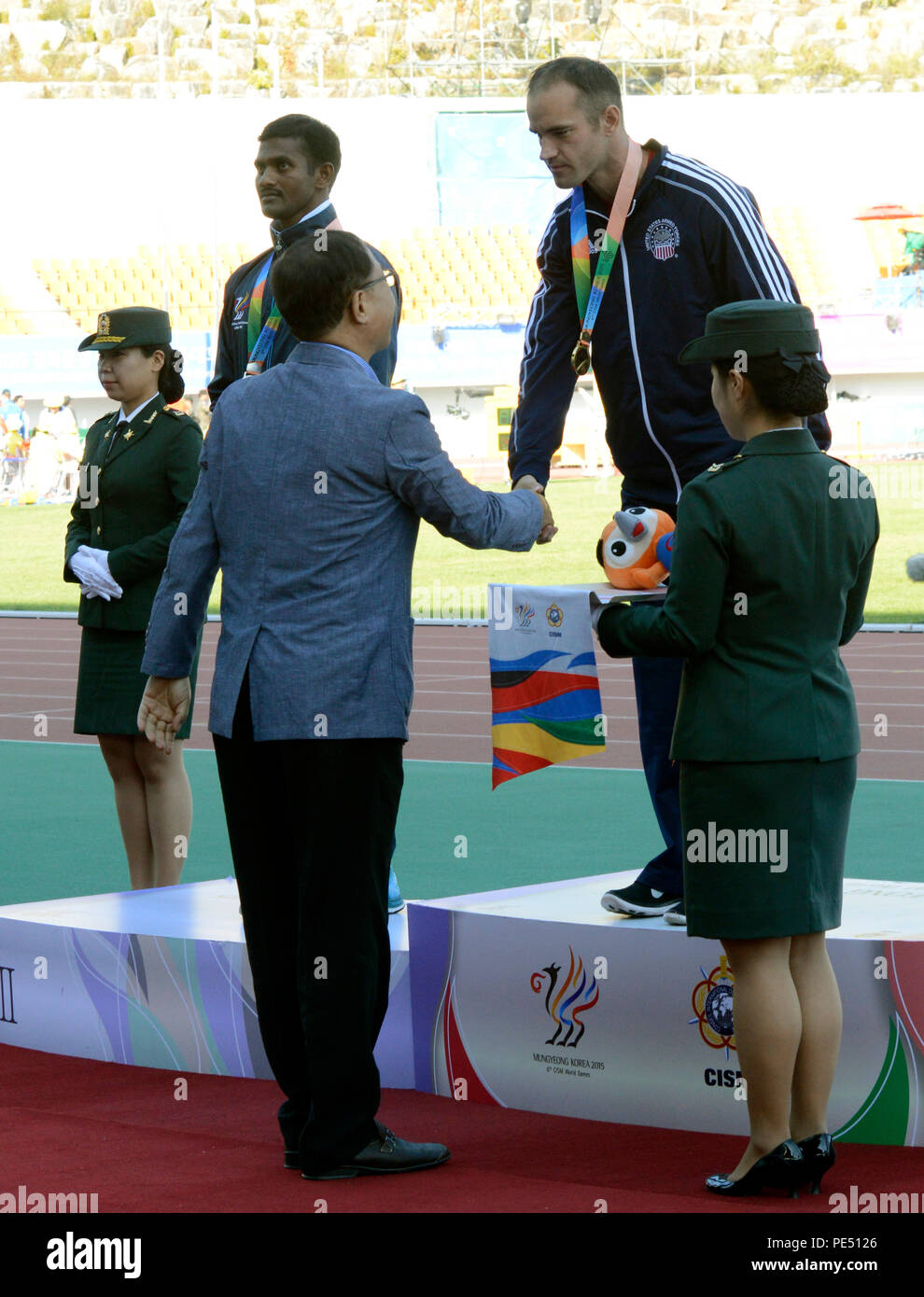 U.S. Army Sgt. Robert Browns shakes hands with Korean Track and Field