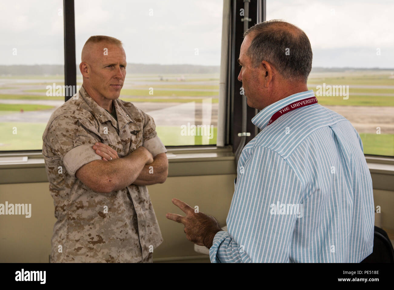 Brig. Gen. Thomas D. Weidley meets with David Wilson during a visit aboard Marine Corps Air Station Beaufort, S.C., Sept. 30, 2015. Part of Weidley’s tour included a military construction brief about ongoing and future projects on the air station. MCAS Beaufort currently has several construction projects underway and more to come in the next few years. Weidley is the commanding general of Marine Corps Installations East. Wilson is the business reform initiative officer aboard the air station. Stock Photo