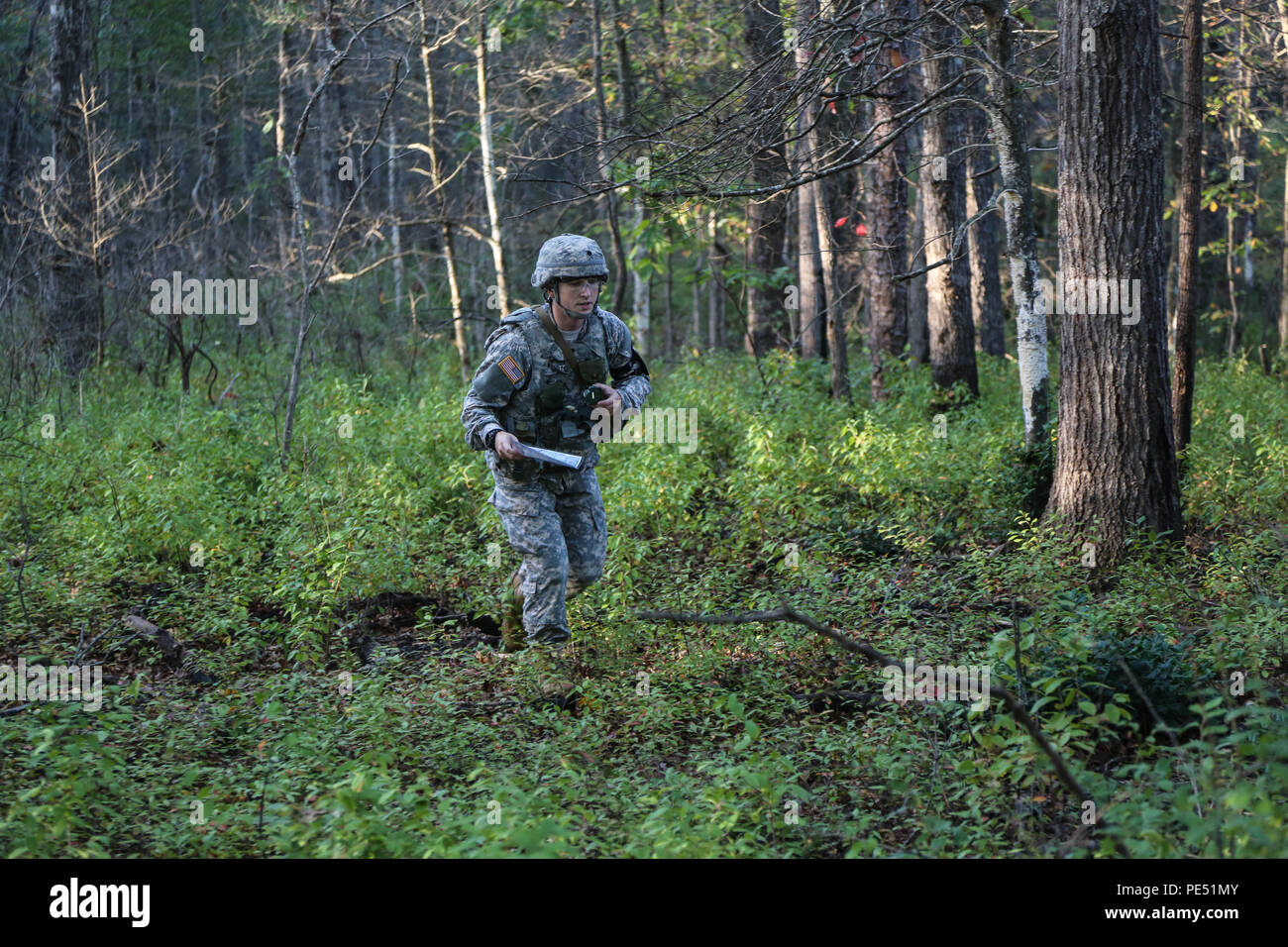 U.S. Army Spc. Adam Walton, assigned to AMC Band, U.S. Army Materiel Command, participates in the obstacle course during the U.S Army's Best Warrior Competition at Fort A.P. Hill, Va., Oct. 5, 2015. The competition is a grueling, weeklong event that tests the skills, knowledge and professionalism of 26 warriors representing 13 commands. (U.S. Army photo by SPC Wes Conroy/Released) #BestWarrior Stock Photo