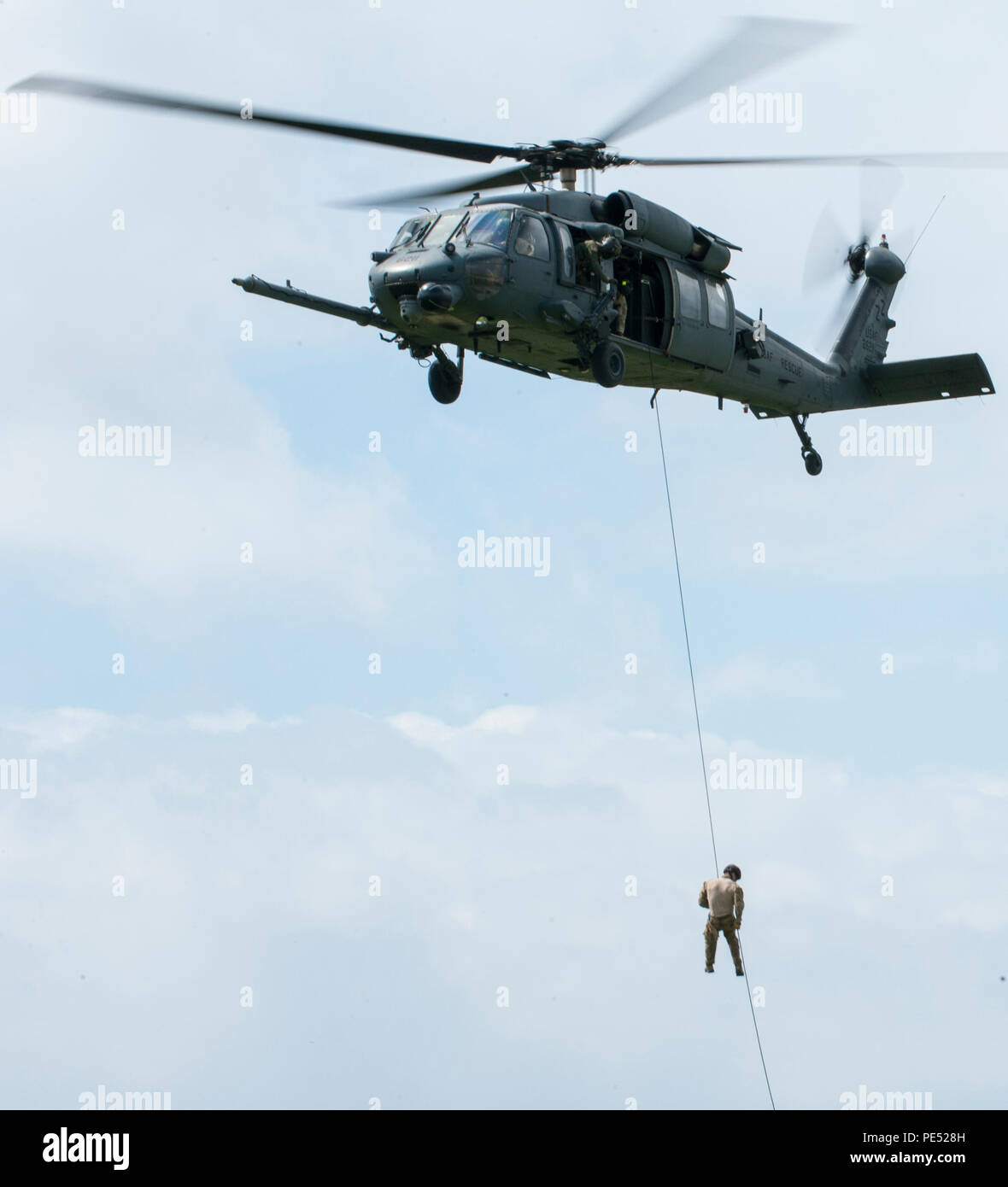 Usaf Rope Rescue A U.S. Air Force pararescueman fast-ropes from a helicopter at Kadena ...