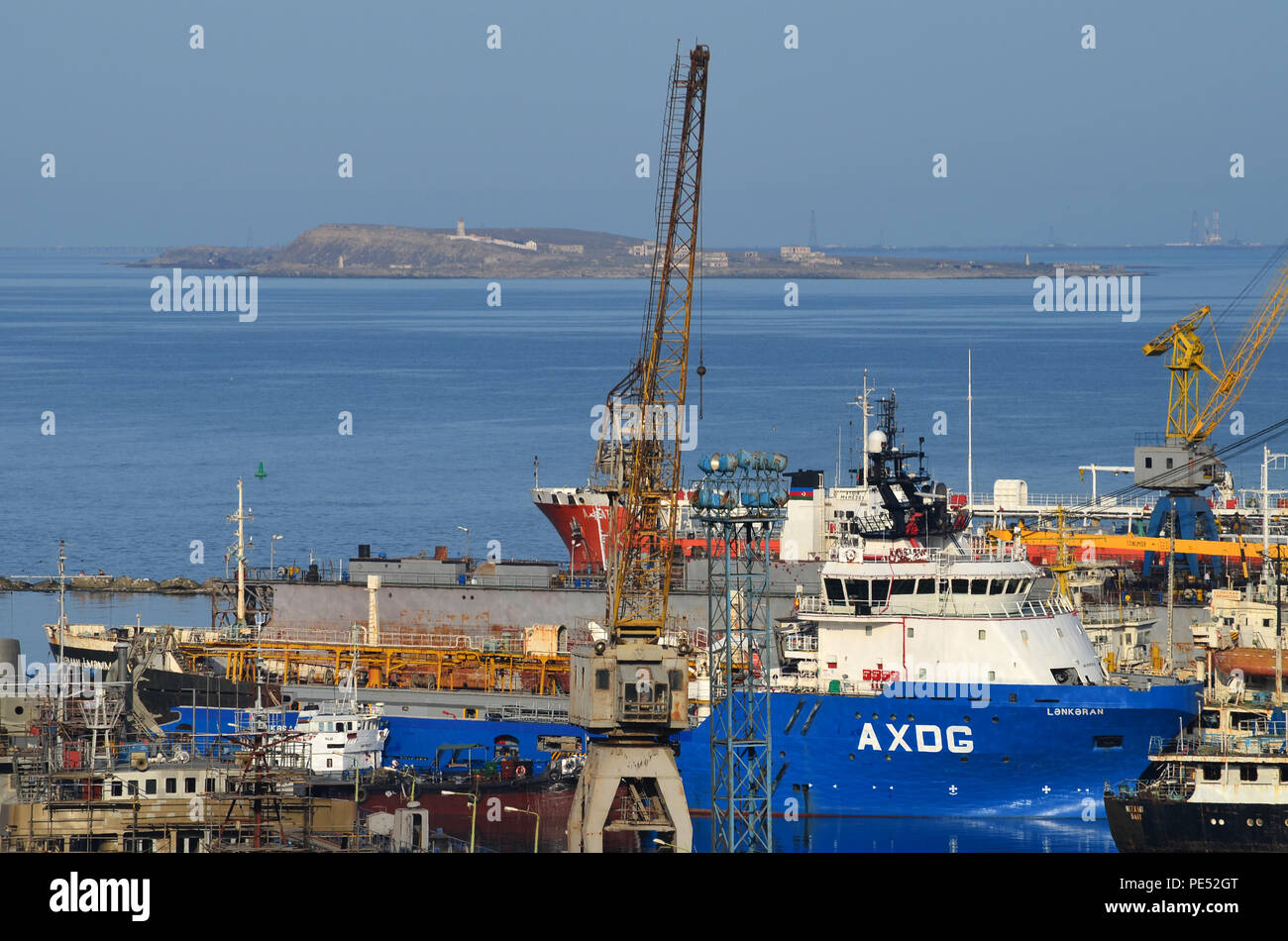 Bibiheybat shipyard in metropolitan Baku (Azerbaijan, Caspian Sea), with Böyük Zirә island in the background Stock Photo
