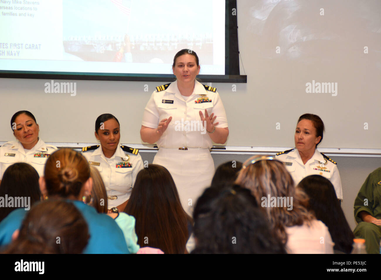 EDINBURG, Texas (Oct. 7, 2015) Chippewa Falls, Wis. native, Lt. Cmdr. Jamie Erickson, operations officer with Navy Recruiting District San Antonio, speaks to young Latinas and their mothers about life in the U.S. Navy during Latina Day held at the 2015 Hispanic Engineering, Science and Technology (HESTEC) Week on the campus of the University of Texas-Rio Grande Valley.  Latina Day provided Latino officer and enlisted Sailors the direct opportunity to provide young Latinas and their mothers with grassroots perspectives on opportunities, benefits, and careers in the Navy.  The Sailors served as  Stock Photo