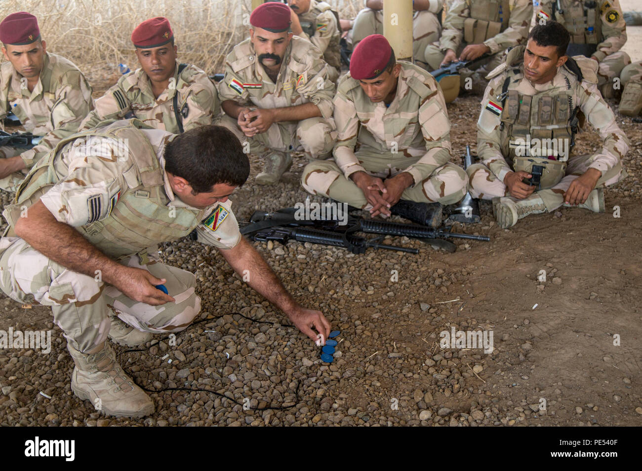 An Iraqi Soldier Uses Rocks As Part Of A Field Expedient