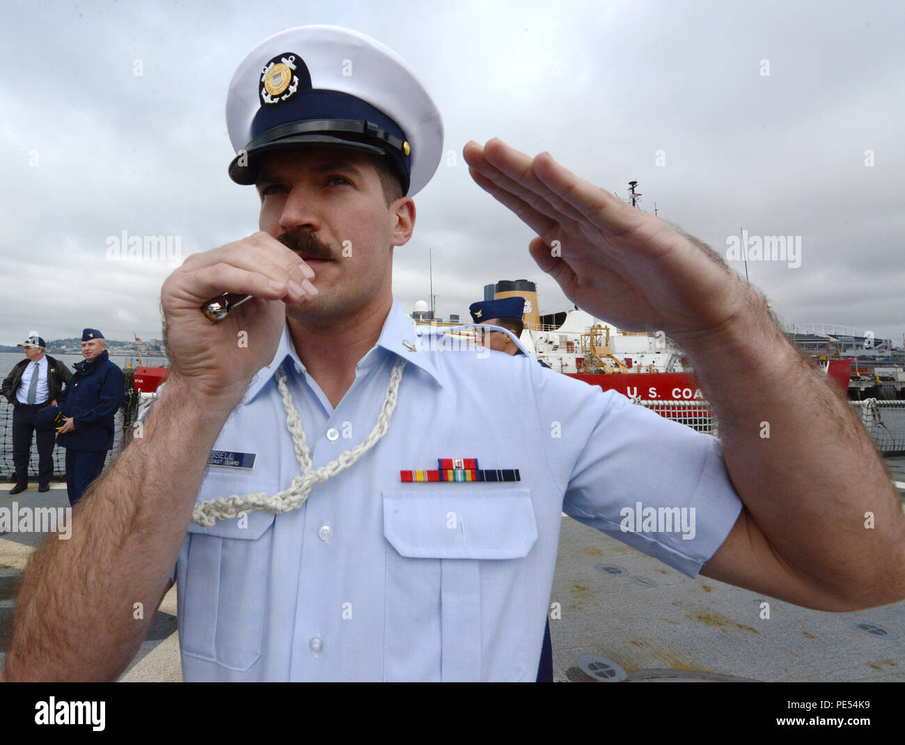 Petty Officer 3rd Class Zachary Fissell, a boatswain's mate, salutes